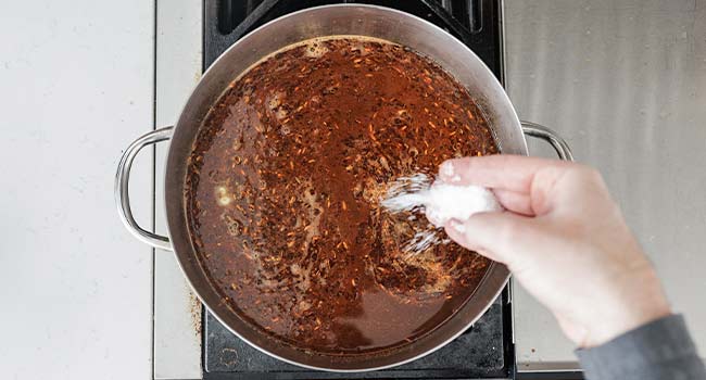 seasoning broth in a pot