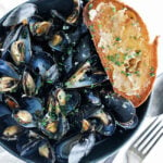 mussels in a bowl with toast