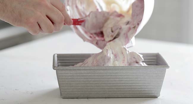 adding ice cream to a container