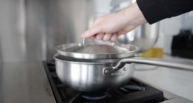 adding a lid to a pot