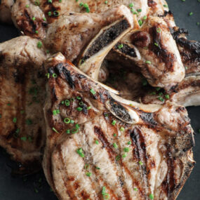 grilled pork chops on a plate