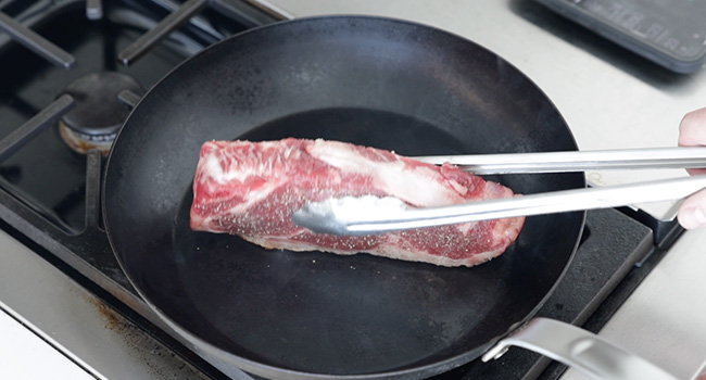 cooking a steak fat cap side down