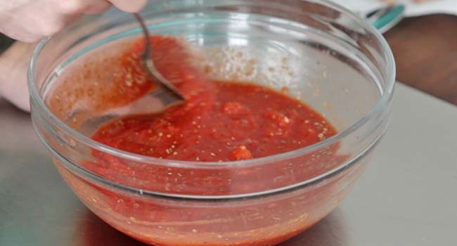 mixing amogio sauce in a bowl