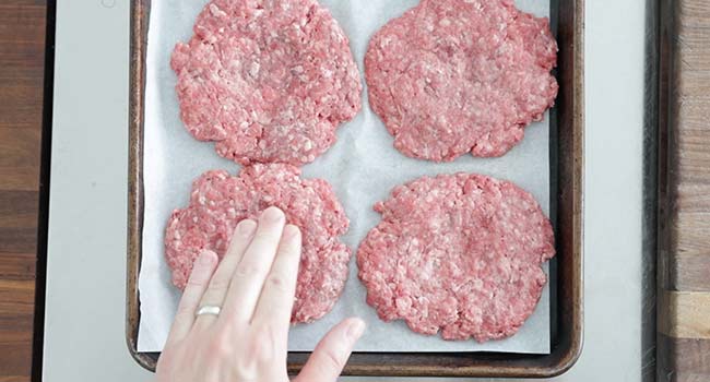 pressing a burger patty