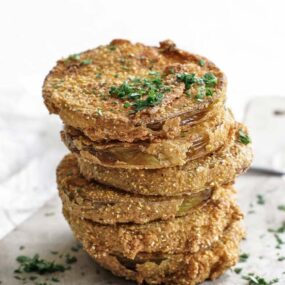 fried green tomatoes on a cutting board