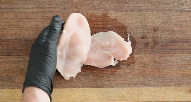 slicing chicken in half