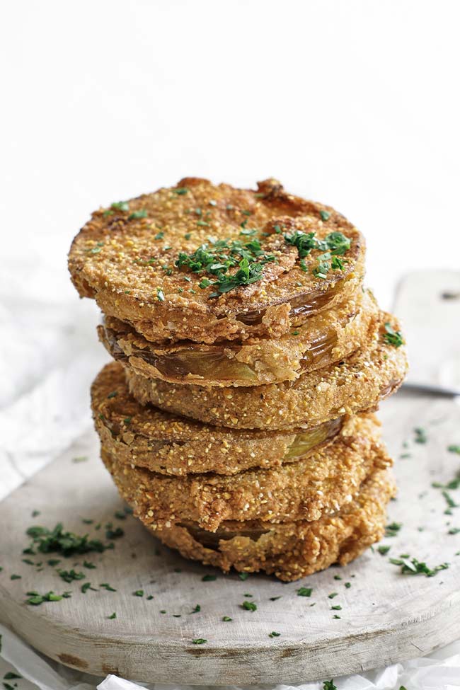 fried green tomatoes on a cutting board