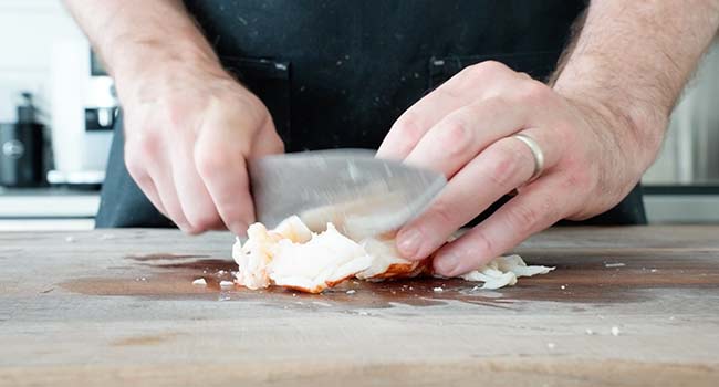 slicing lobster meat