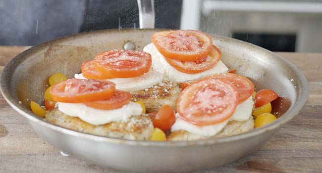 tomatoes and cheese on chicken