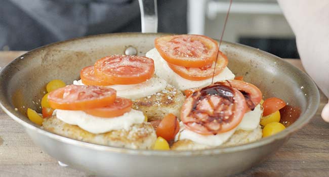 drizzling balsamic vinegar on tomatoes and chicken