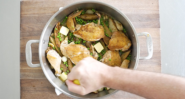 adding lemon and butter to chicken vesuvio