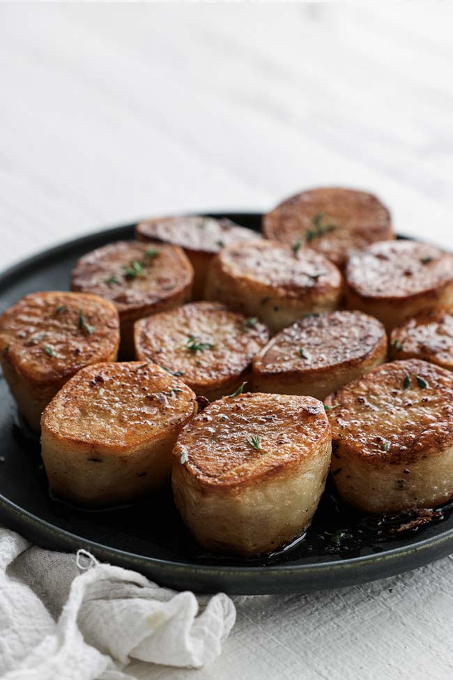 fondant potatoes on a plate