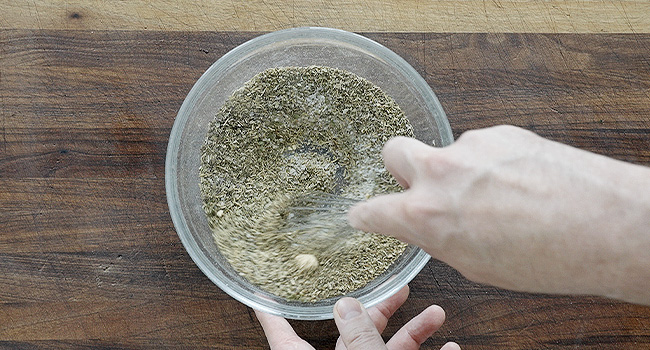 whisking a seasoning blend