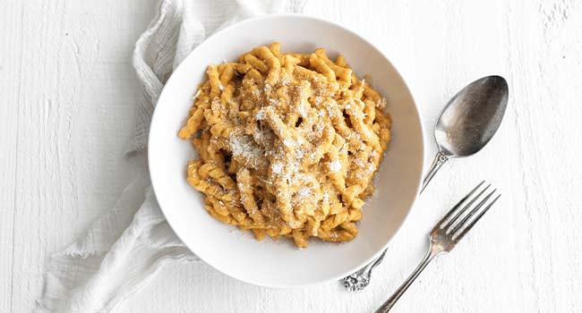 pesto alla siciliano in a bowl with cheese