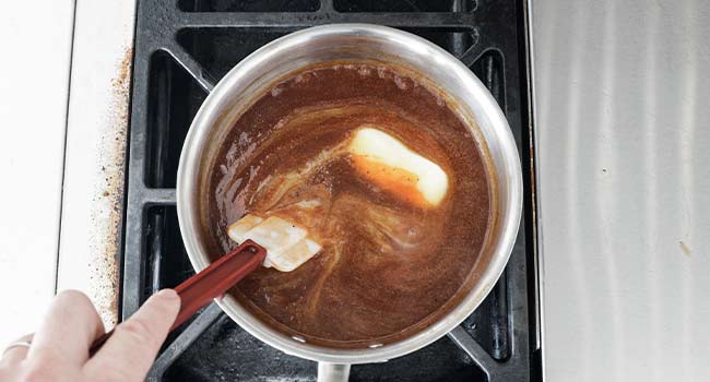 mixing bbq sauce with butter