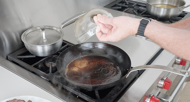 adding soy to a pan