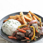 beef lomo saltado with french fries and rice