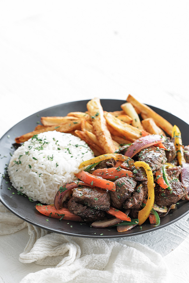 beef lomo saltado with french fries and rice