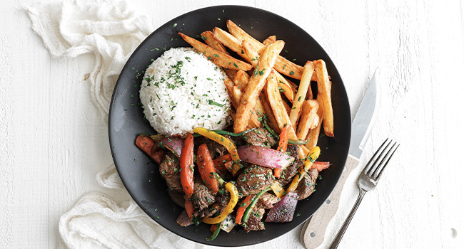 beef stir fry with fries and rice