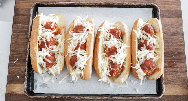 adding cheese to meatball subs