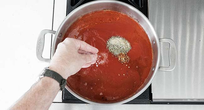 tomato sauce with herbs in a pot