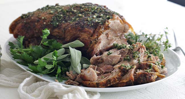 sliced pork shoulder roast with herbs