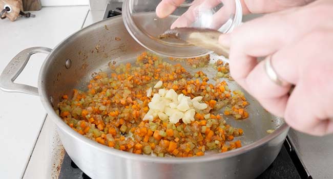 adding garlic to mirepoix