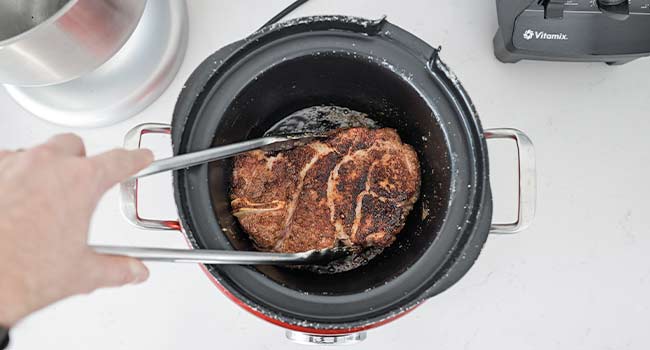 seared pork in a slow cooker