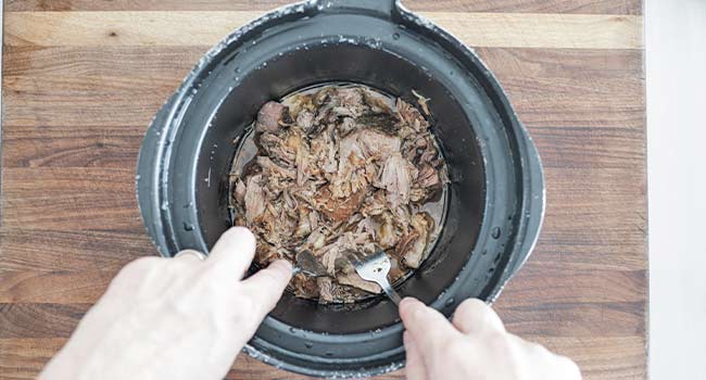 pulling pork in a slow cooker