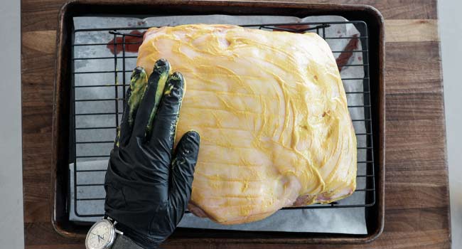 coating a pork butt in mustard