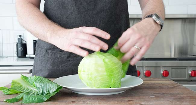 removing leaves from cabbage