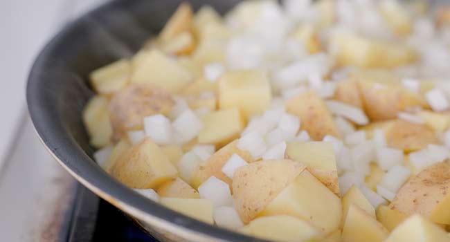 frying potatoes and onions