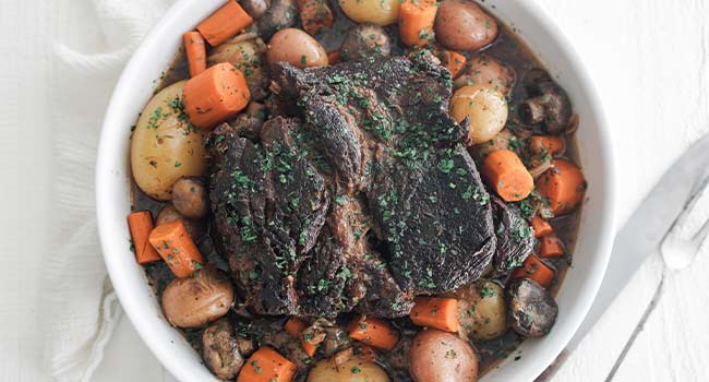 slow cooked pot roasted with potatoes and carrots