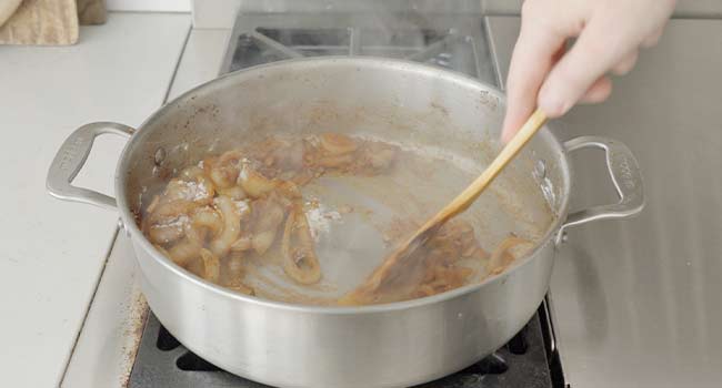 stirring roux into onions