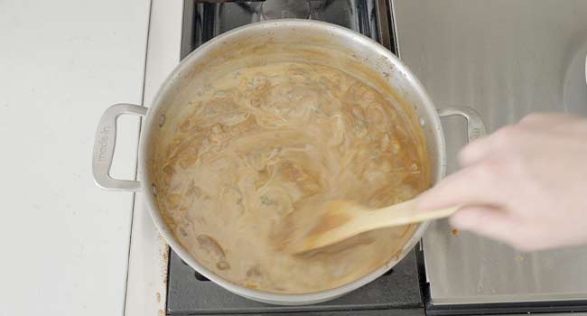 stirring cream into gravy