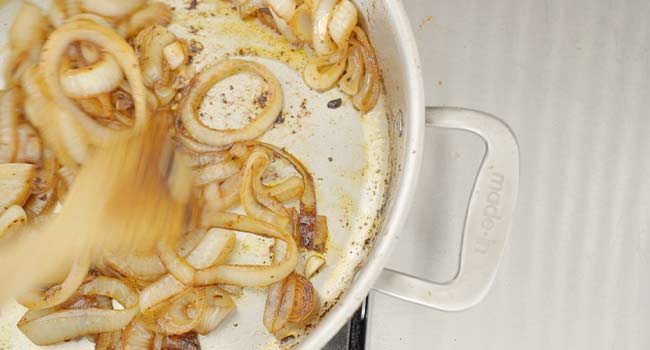 stirring onions and garlic