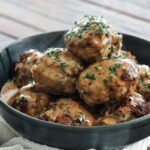 swedish meatballs in a bowl with gravy