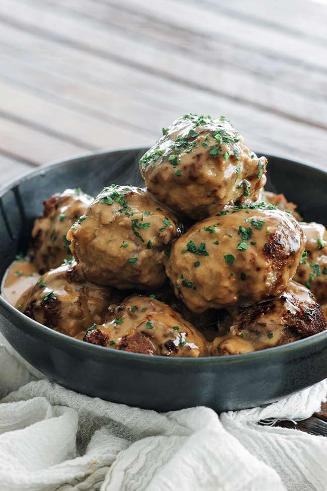 swedish meatballs in a bowl with gravy