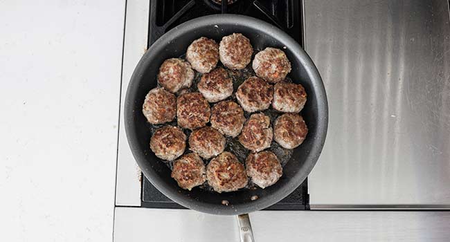 browning swedish meatballs in a pan