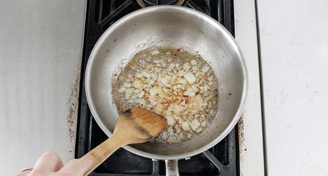 sauteing onions in a pot