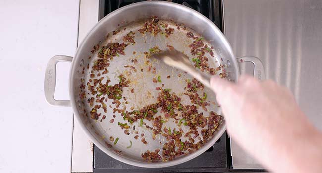 cooking peppers and onions