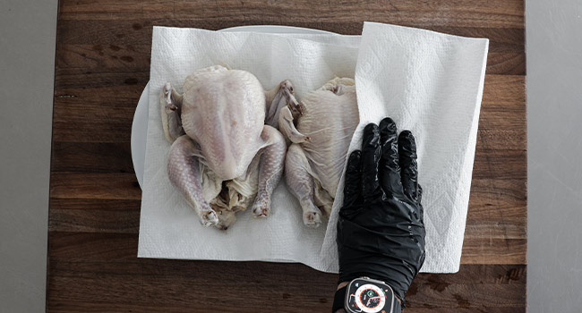 patting hens dry with paper towels