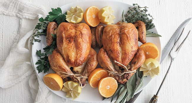 cooked cornish hens with garnishes