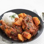 colombian chicken stew in a bowl with rice