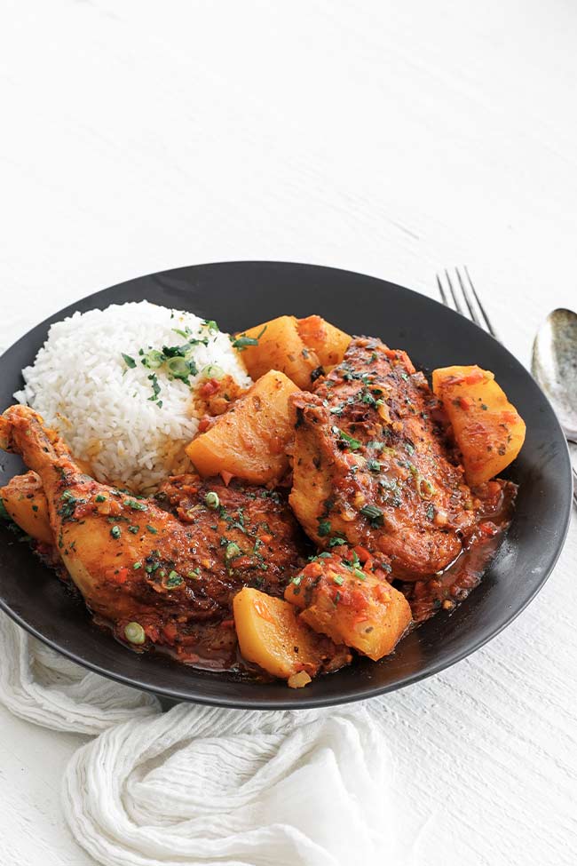 colombian chicken stew in a bowl with rice