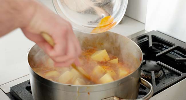 adding potatoes and yucca to a sdtwe