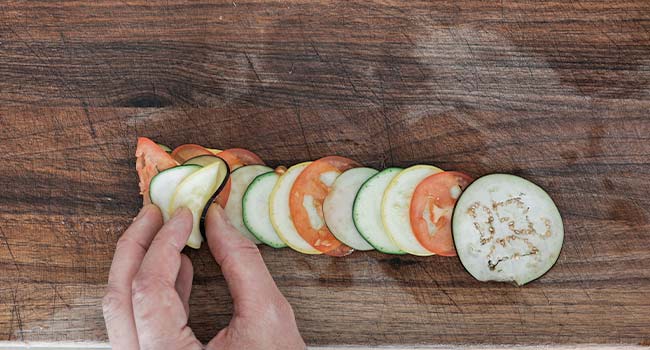 rolling up sliced veggies