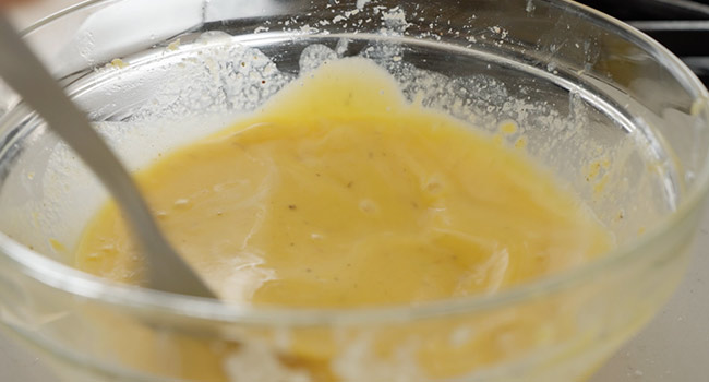 whisking eggs and water