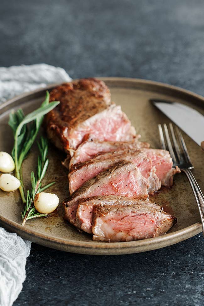 sliced steak on a plate