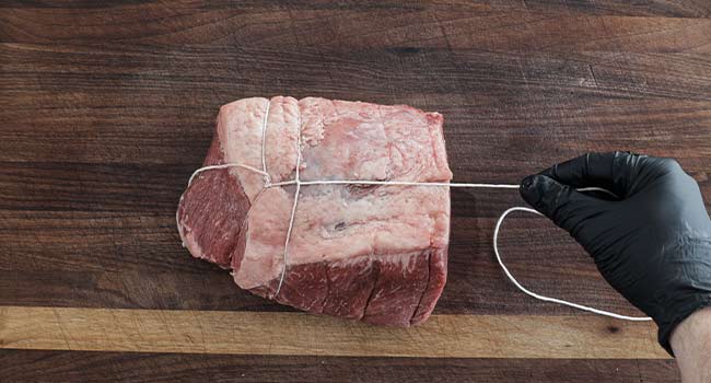 creating tension with twine on beef